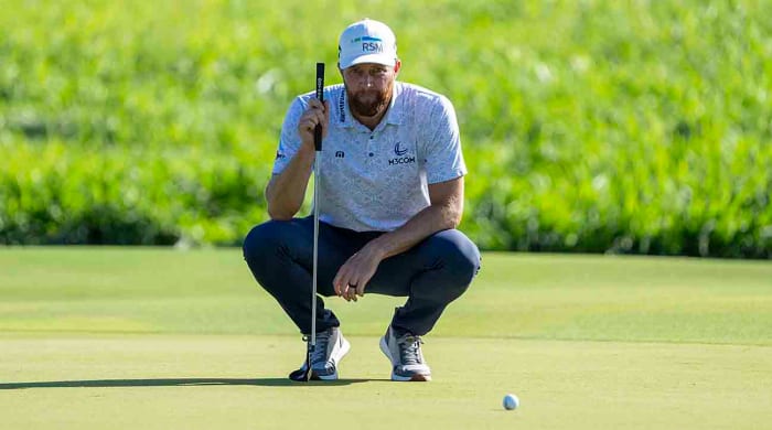 Chris Kirk lines up his putt on the second hole during the final round of the 2024 Sentry golf tournament at Kapalua.